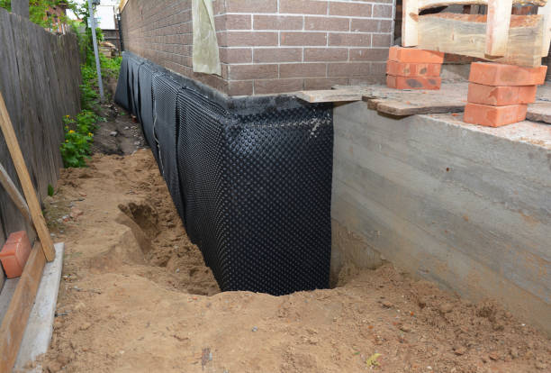 Happy homeowners after waterproofing job in Benton Harbor